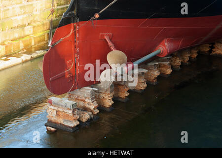 Propellers and hull of S S Nomadic, tender to the Titanic lying in Hamilton Dock, Belfast home of Titanic with the Titanic Stock Photo