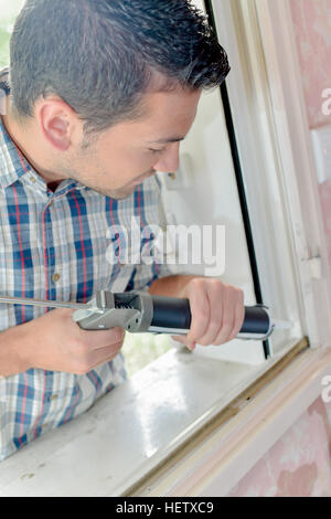 glazier working on a window Stock Photo