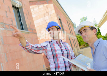 Two architects working on site Stock Photo