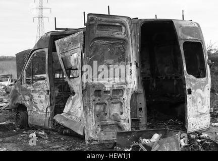 Burnt Out Van in Black and White Stock Photo