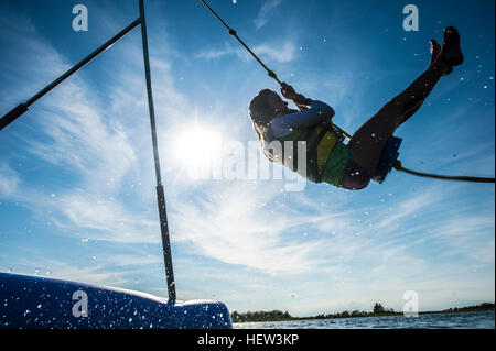 Girl swinging on rope, Seaside Heights, New Jersey, USA Stock Photo