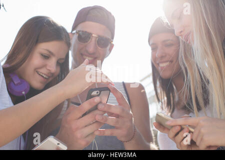 Friends social-networking on smartphones Stock Photo