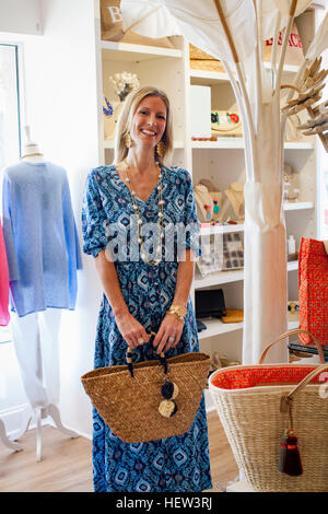 Portrait of mature female shop owner in her fashion boutique Stock Photo
