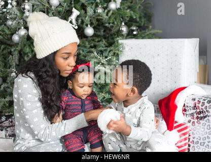 Family Portrait by the Christmas Tree Stock Photo