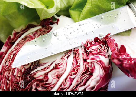 Radicchio cut in half by a knife Stock Photo