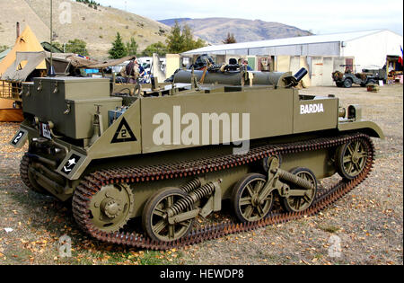 The Universal Carrier, also known as the Bren Gun Carrier from the light machine gun armament, is a common name describing a family of light armoured tracked vehicles built by Vickers-Armstrong and other companies.   The first carriers - the Bren Carrier and the Scout Carrier with specific roles - entered service before the war, but a single improved design that could replace these, the Universal, was introduced in 1940.   The vehicle was used widely by British Commonwealth forces during the Second World War. Universal Carriers were usually used for transporting personnel and equipment, mostly Stock Photo