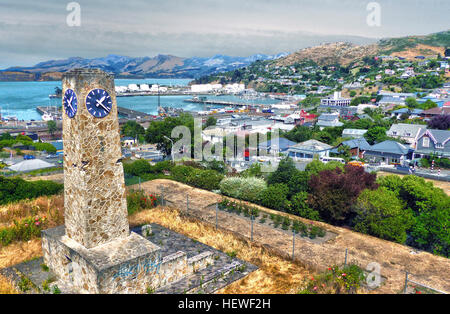 Of course, you get the best views of Lyttelton Harbour from the Summit Road, Bridle Path and the summits above Diamond Harbour on Banks Peninsula. But the rose garden around the Upham Memorial Clock Tower is a great place which offers nice views and you do not have to walk very far, and it really is just a short stroll from the town centre and a minute up a steep stone staircase.  The Town Clock is dedicated to Dr. Charles Hazlitt Upham (1863-1950), gratefully and lovingly named &quot;The Little Doctor&quot;. He dedicated 52 years of his life to the community and was acclaimed as the most prac Stock Photo