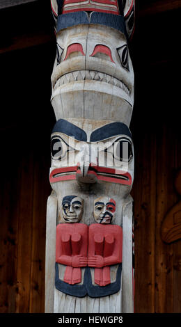 Totem poles are monumental sculptures carved from large trees, mostly Western Red Cedar, by cultures of the indigenous peoples of the Pacific Northwest ... Stock Photo