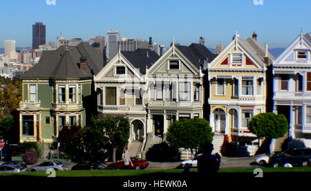 One of the most photographed locations in San Francisco, Alamo Square's famous &quot;postcard row&quot; at Hayes and Steiner Streets is indeed a visual treat. A tight, escalating formation of Victorian houses is back-dropped by downtown skyscrapers, providing a stunning contrast. The grassy square itself is an ideal midday break. One of 11 historic districts designated by the Department of City Planning, the area includes several bed and breakfast inns. Stock Photo
