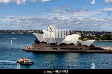 ication (,),,,Australia,Australian Ballet,Bennelong Point, Sydney,Expressionist architecture,Harbour cruise Sydney,Joan Sutherland Theatre,Louis Kahn,Mirror  Water,Opera Australia,Reflection,Sydney Australia,Sydney Hop On Hop Off Bus,Sydney Opera House,Sydney Symphony Orchestra,Sydney Theatre Company,Sydney harbour,Sydney harbour cruises,Sydney sightseeing,Sydney views,Things to do in Sydney,White sails,Wonders of the World,architecture,concert venue,modern architecture,performing arts,performing arts centre Stock Photo