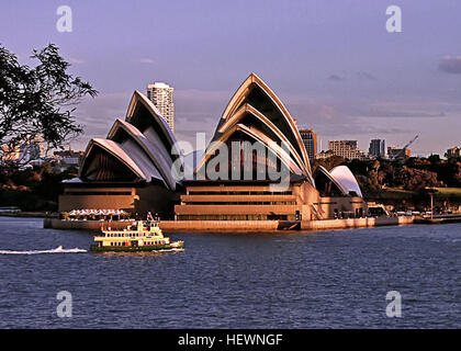 ication (,),,,Australia,Australian Ballet,Bennelong Point, Sydney,Expressionist architecture,Harbour cruise Sydney,Joan Sutherland Theatre,Louis Kahn,Mirror  Water,Opera Australia,Reflection,Sydney Australia,Sydney Hop On Hop Off Bus,Sydney Opera House,Sydney Symphony Orchestra,Sydney Theatre Company,Sydney harbour,Sydney harbour cruises,Sydney sightseeing,Sydney views,Things to do in Sydney,White sails,Wonders of the World,architecture,concert venue,modern architecture,performing arts,performing arts centre Stock Photo