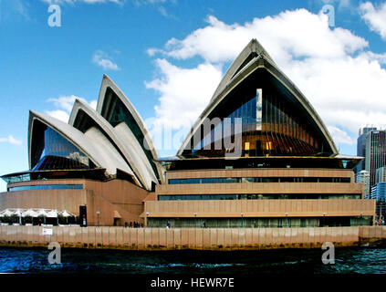 ication (,),,,Australia,Australian Ballet,Bennelong Point, Sydney,Expressionist architecture,Harbour cruise Sydney,Joan Sutherland Theatre,Louis Kahn,Mirror  Water,Opera Australia,Reflection,Sydney Australia,Sydney Hop On Hop Off Bus,Sydney Opera House,Sydney Opera House Roof,Sydney Opera House windowsf,Sydney Symphony Orchestra,Sydney Theatre Company,Sydney harbour,Sydney harbour cruises,Sydney sightseeing,Things to do in Sydney,White sails,Wonders of the World,architecture,concert venue,modern architecture,performing arts,performing arts centre Stock Photo