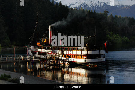 The TSS Earnslaw is a 1912 Edwardian vintage twin screw steamer plying the waters of Lake Wakatipu in New Zealand. It is one of the oldest tourist attractions in Central Otago, and the only remaining commercial passenger-carrying coal-fired steamship in the southern hemisphere Stock Photo