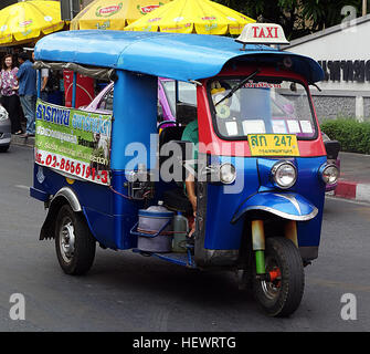 Auto rickshaws are a common means of public transportation in many countries in the world. Also known as a three-wheeler, Samosa, tempo, tuk-tuk, trishaw, auto, rickshaw, autorick, bajaj, rick, tricycle, mototaxi, baby taxi or lapa in popular parlance, an auto rickshaw is a usually three-wheeled cabin cycle for private use and as a vehicle for hire. It is a motorized version of the traditional pulled rickshaw or cycle rickshaw. Auto rickshaws are an essential form of urban transport in many developing countries, and a form of novelty transport in many Eastern countries. Stock Photo