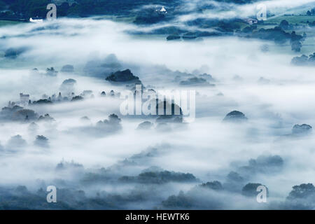 Early morning mist over fields and Crosthwaite Church near Keswick, Lake District, Cumbria, England.  Taken from Latrigg. Stock Photo