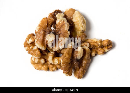 Stack of unshelled walnuts isolated on white background Stock Photo