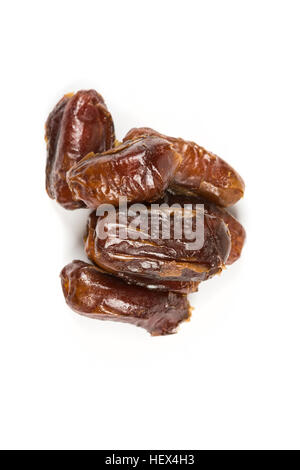 Whole pitted dates isolated on white background