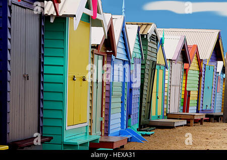 Dendy Street Beach, just south of Middle Brighton, features 82 colourful bathing boxes which are one of the tourist icons of Melbourne. The boxes share a uniformity of size and build, and a regular arrangement along the beach, and are the only surviving such structures close to the Melbourne CBD  A Planning Scheme Heritage Overlay on the boxes by the Bayside City Council restricts alterations, and all retain their Victorian era architecture, such as timber frames, weatherboard sidings, and corrugated iron roofs, without amenities such electricity or running water. The bathing boxes may only be Stock Photo