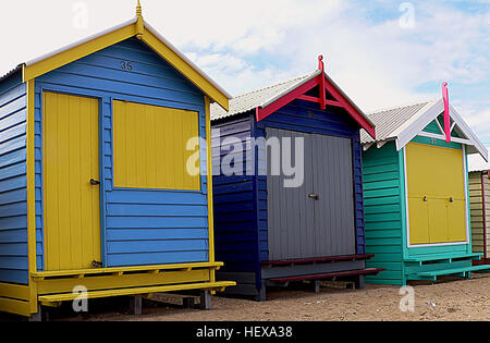 Dendy Street Beach, just south of Middle Brighton, features 82 colourful bathing boxes, which are one of the tourist icons of Melbourne. The boxes share a uniformity of size and build, and a regular arrangement along the beach, and are the only surviving such structures close to the Melbourne CBD. A Planning Scheme Heritage Overlay on the boxes by the Bayside City Council restricts alterations, and all retain their Victorian era architecture, such as timber frames, weatherboard sidings, and corrugated iron roofs, without amenities such electricity or running water. The bathing boxes may only b Stock Photo