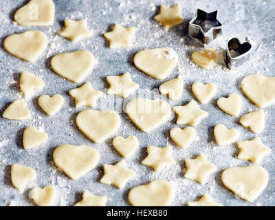 Heart and star shapes cookies with cookie cutters Stock Photo