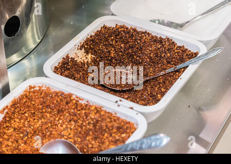 Ground red pepper and dried peppers closeup Stock Photo