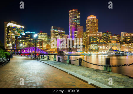 The Boston skyline and Fort Point Channel at night, in Boston, Massachusetts. Stock Photo