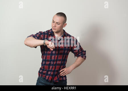 Portrait of a Successful Young Man Standing Isolated on Grey Background Stock Photo