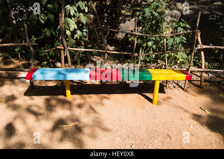 Multi-Colored metal bench in a school in Hyderabad,India Stock Photo