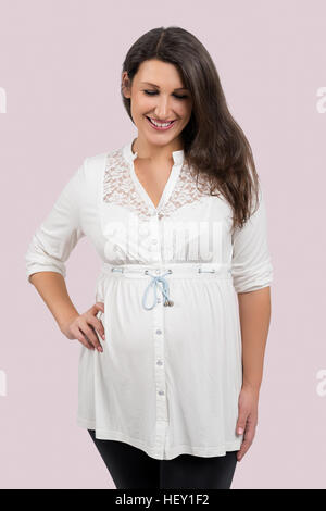 Portrait of a beautiful cheerful pregnant woman Stock Photo