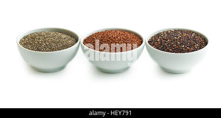 Red and black quinoa and chia seeds in bowl isolated on white background. Stock Photo