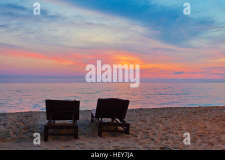 Wooden chairs  on beach in sunset time at Phu Quoc island in Vietnam Stock Photo