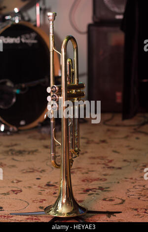 trumpet standing on the floor of the music Studio Stock Photo