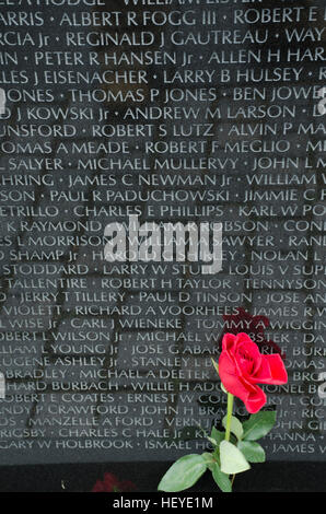 Reflections, people, and objects at the Wall of the Vietnam Veterans Memorial in Washington, DC. Stock Photo