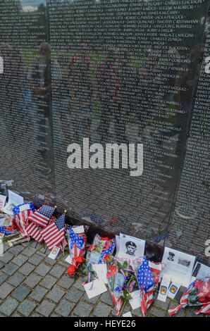 Reflections, people, and objects at the Wall of the Vietnam Veterans Memorial in Washington, DC. Stock Photo