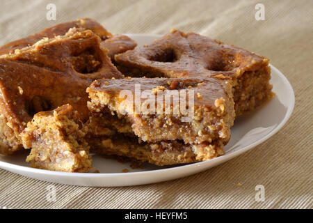 Turkish baklava with walnuts on a white plate Stock Photo