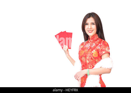 Beautiful Asian girl in Chinese qipao traditional dress, holding red money pockets or greeting card envelopes, Chinese new year concept, isolated on w Stock Photo