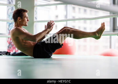 Young athlete trains in gym Stock Photo