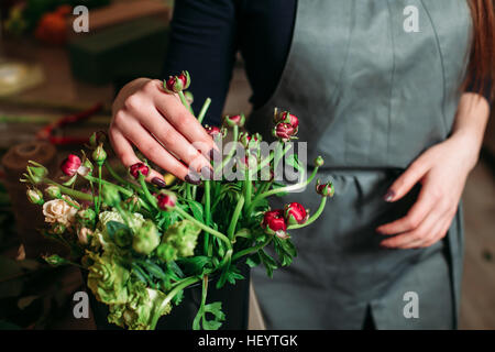 Florist with beautiful flowers. Stock Photo