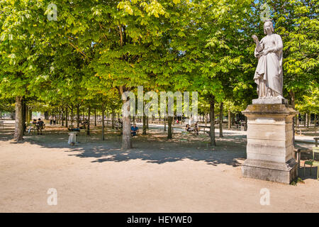 people relaxing in the shade in luxembourg gardens, sculpture showing anne de bretagne on the right Stock Photo