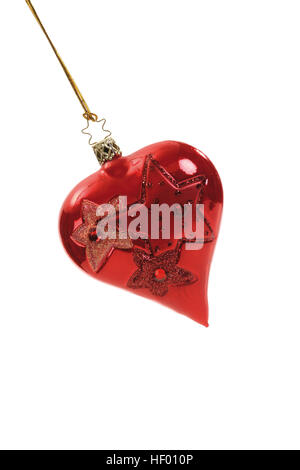 Red heart-shaped Christmas ornament on gold thread Stock Photo