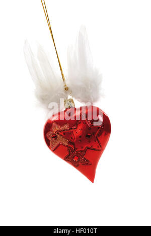 Red heart-shaped Christmas ornament with angel wings on gold thread Stock Photo