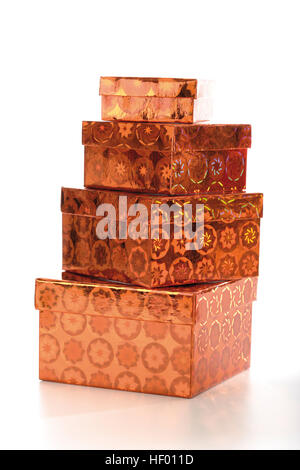 Four copper-coloured gift boxes, stacked Stock Photo