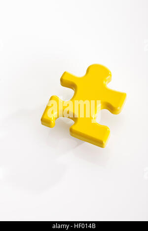 Yellow puzzle piece Stock Photo