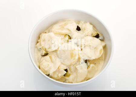 Bowl of potato salad with mayonnaise and pieces of pickle Stock Photo