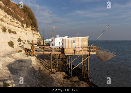 Traditional fishing huts built on stilts with fishing nets on the shore, Gironde Estuary, Meschers-sur-Gironde, Cote de Beaute Stock Photo