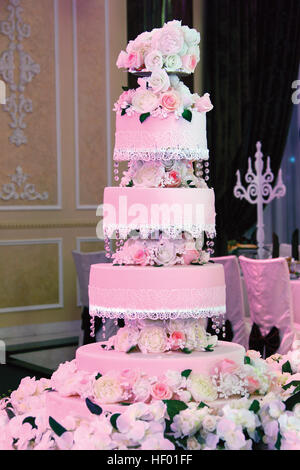 Big white wedding cake with flowers. Stock Photo