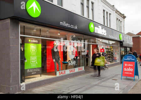 Southport, Merseyside, UK. 24th December, 2016. Pre Boxing Day Sales.   Stores in the town are now displaying tentative sale signs and some plan early closing as they prepare for a Sales Bonanza in the next 48 hours. Last minute shoppers are taking advantage of discounts of up to 50% on selected goods. Credit: MediaWorldImages/Alamy Live News Stock Photo