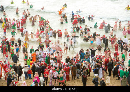 Bournemouth, Dorset, UK . 25th Dec, 2016. Christmas Day swimmers take to the sea at Boscombe, Bournemouth, UK 25 December 2016 © John Beasley/Alamy Live News Stock Photo