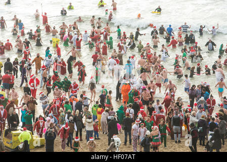 Bournemouth, Dorset, UK . 25th Dec, 2016. Christmas Day swimmers take to the sea at Boscombe, Bournemouth, UK 25 December 2016 © John Beasley/Alamy Live News Stock Photo