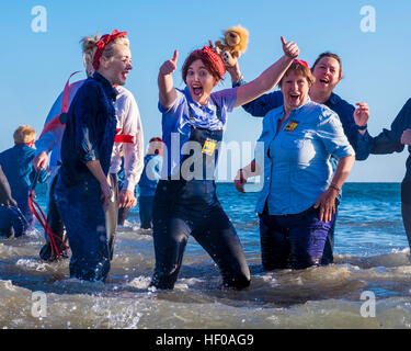 Hardy souls take to the North Sea in fancy dress in Sunderland's annual Boxing Day Dip. The dip is arranged by the Sunderland Lions Club and raises money for charity. Stock Photo